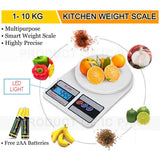 Kitchen weight scale with digital display, surrounded by fruits and vegetables, and batteries on a white background.