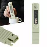 TDS-3 water quality tester with digital display held over a cup, showing close-up details on a white background.