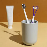 Dual-head tongue scraper made from stainless steel for thorough and comfortable tongue cleaning.
