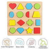 A wooden children's shape-sorting puzzle board with colorful geometric pieces arranged in a grid on a light wood background. Below the board are four illustrated icons with text: Color Recognition, Motor Skills, Creativity, and Hand-eye Coordination.