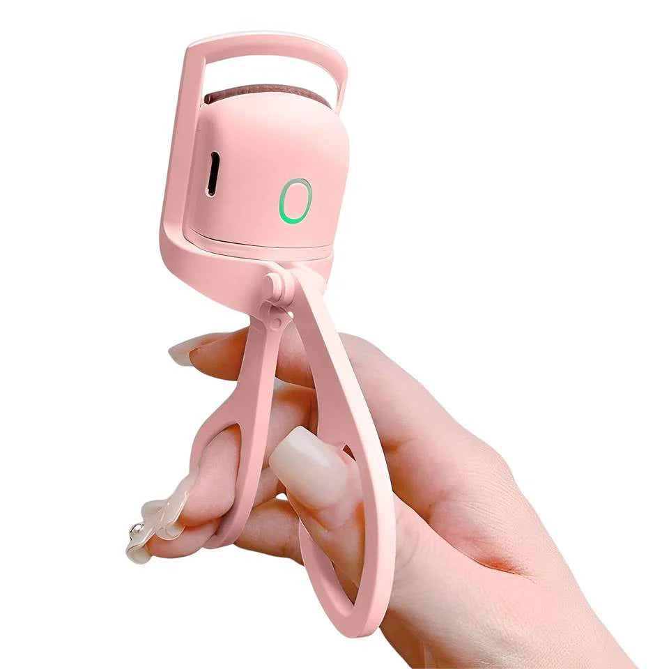 Pink handheld device with a handle held by a hand on a white background