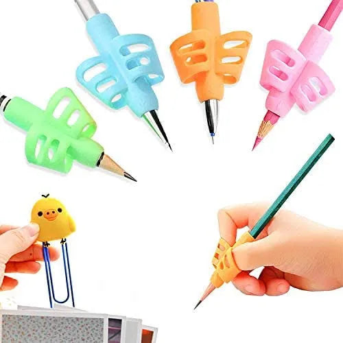Colorful pencil grips on pencils held by hands with a small yellow duck toy.