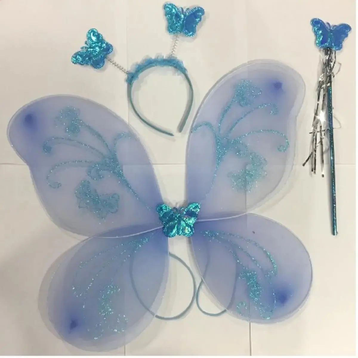 Butterfly costume set with wings, headband, and wand on a white background