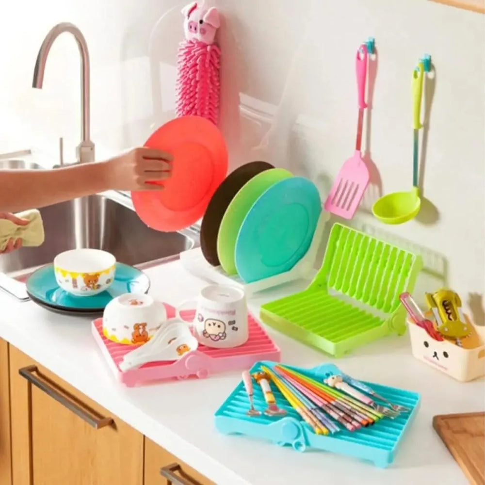 Foldable kitchen dish drying rack designed to save space while drying plates and utensils.
