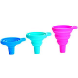 Three collapsible silicone funnels in blue, green, and pink on a white background