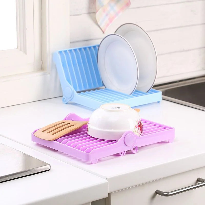 Folding dish drainer rack for efficient water drainage and clutter-free kitchen organization.