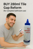 Man holding a bottle of Tile Gap Reform against a tiled bathroom wall.