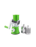 Green manual rotary cheese grater with additional grating attachments on a white background