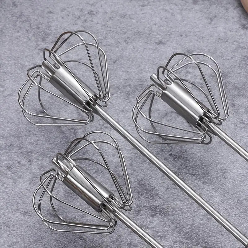 Hand push egg beater mixer for preparing eggs, sauces, and baking mixtures with ease.