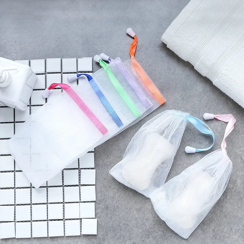 Mesh soap saver pouch designed to hold soap bars and help them dry between uses.