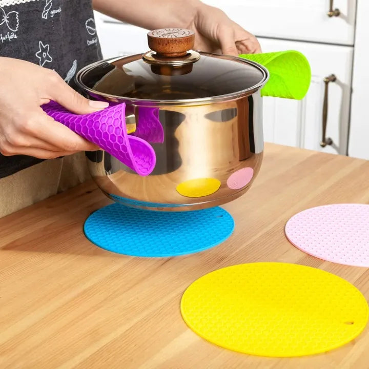 Heat-resistant silicone pot holder mat for safely handling hot pots, pans, and cookware.