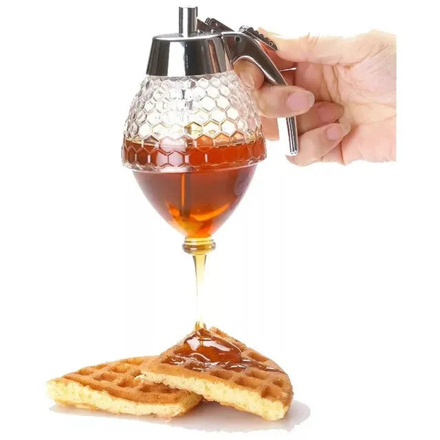 Honey dispenser drizzling honey onto a waffle with a white background