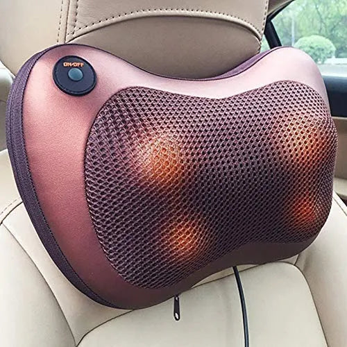 Pink and brown neck massager with glowing lights on a car seat