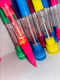 Colorful pens with transparent bodies and multicolored caps on a white background