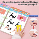 Children's educational book with letter 'A' and apple illustration, hand wiping text, on pink background.
