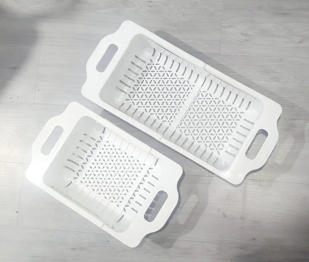 Kitchen dish drainer rack with a durable plastic design for neat and organized dish drying.