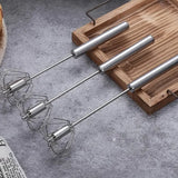Manual hand push egg whisk designed for effortless whisking and blending in the kitchen.