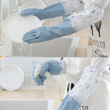 Person wearing blue rubber gloves washing dishes with a focus on the gloves and cleaning action.