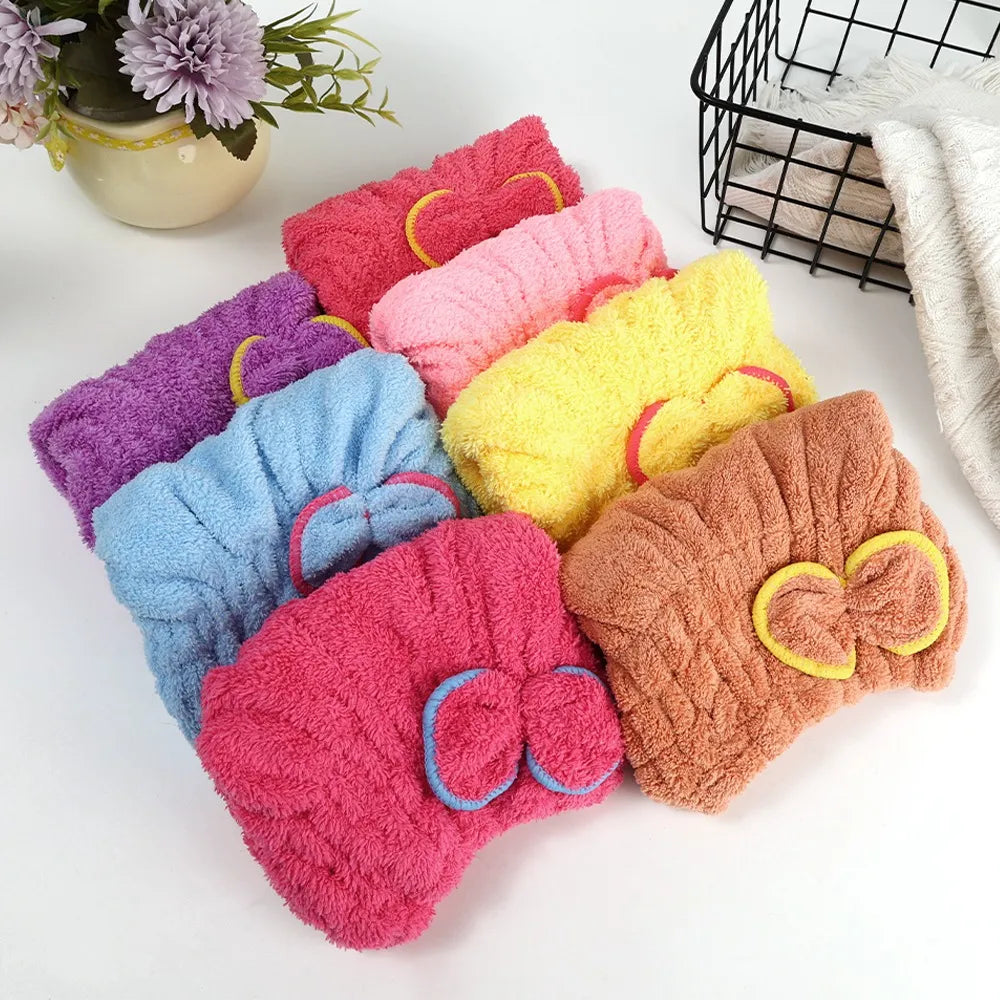 Microfiber hair drying cap with a cute bow for absorbing moisture after washing hair.