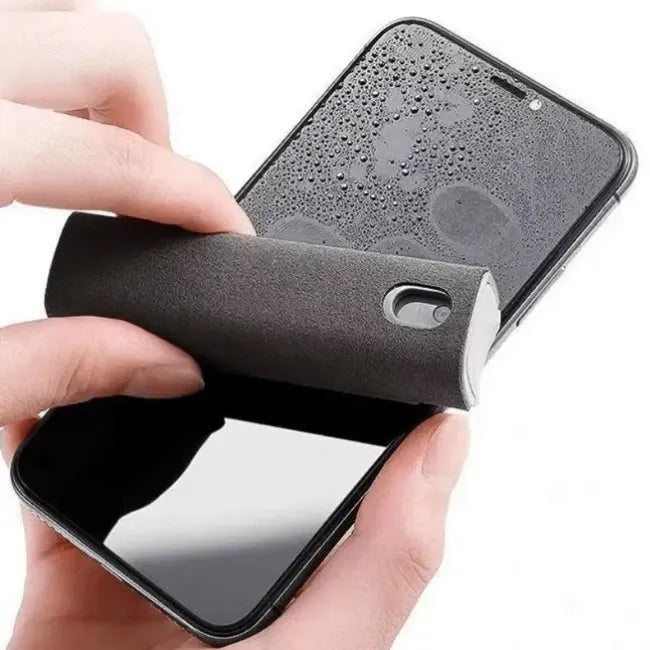 Person cleaning a smartphone screen with a black cleaning tool