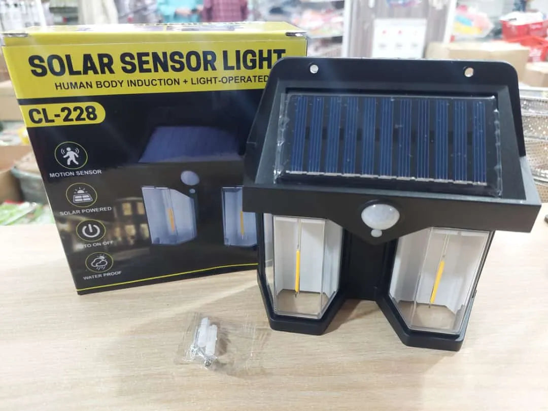 Solar sensor light with packaging on a table