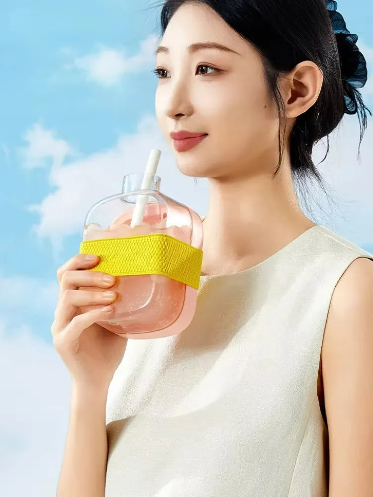 Multi-function 500ml water bottle with a reusable ice cube tray for convenient everyday use.