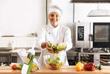 Chef preparing a salad in a professional kitchen