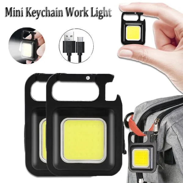 Mini keychain work light with USB cable and usage on a backpack.
