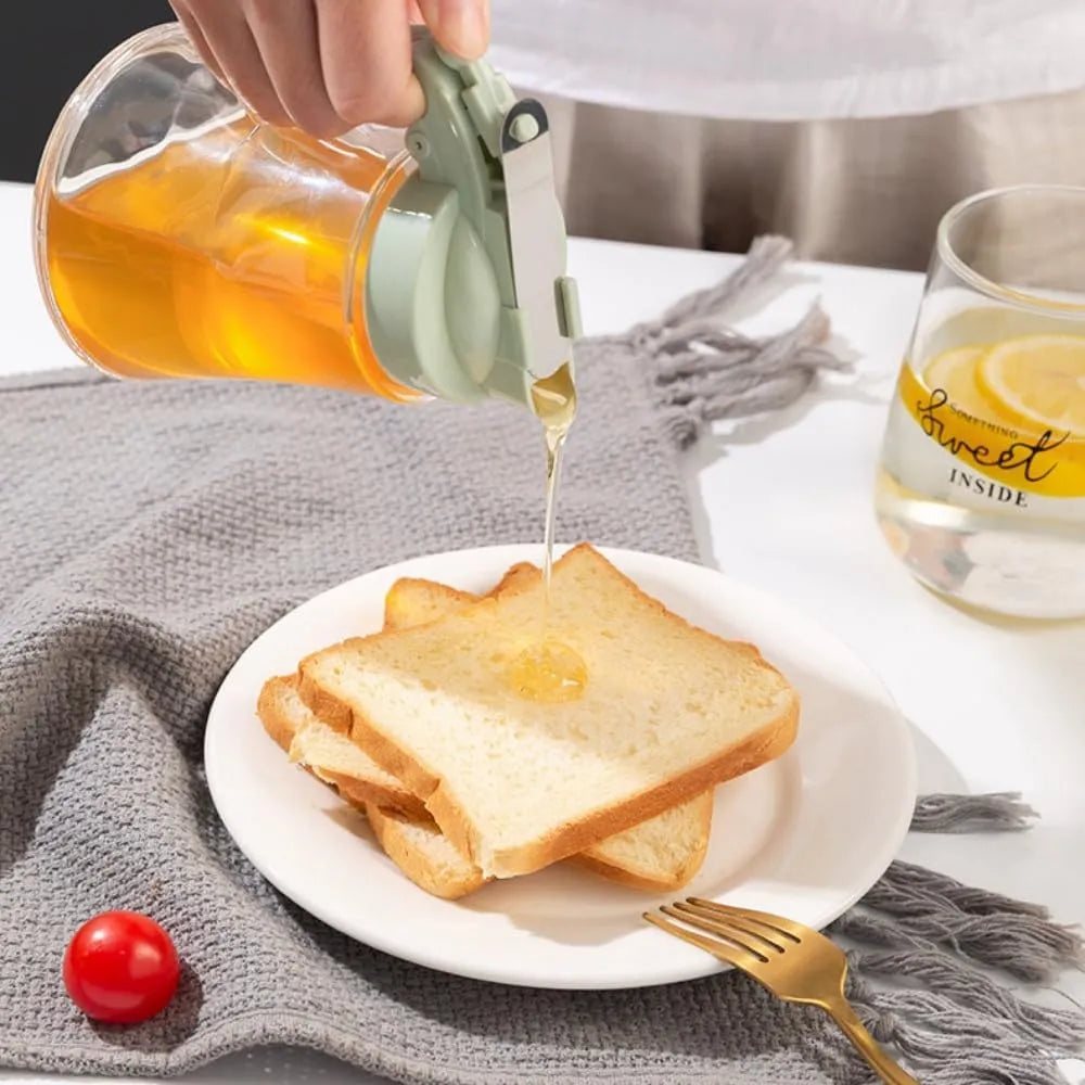 Person pouring syrup onto toast on a white plate with a glass of lemon water in the background.