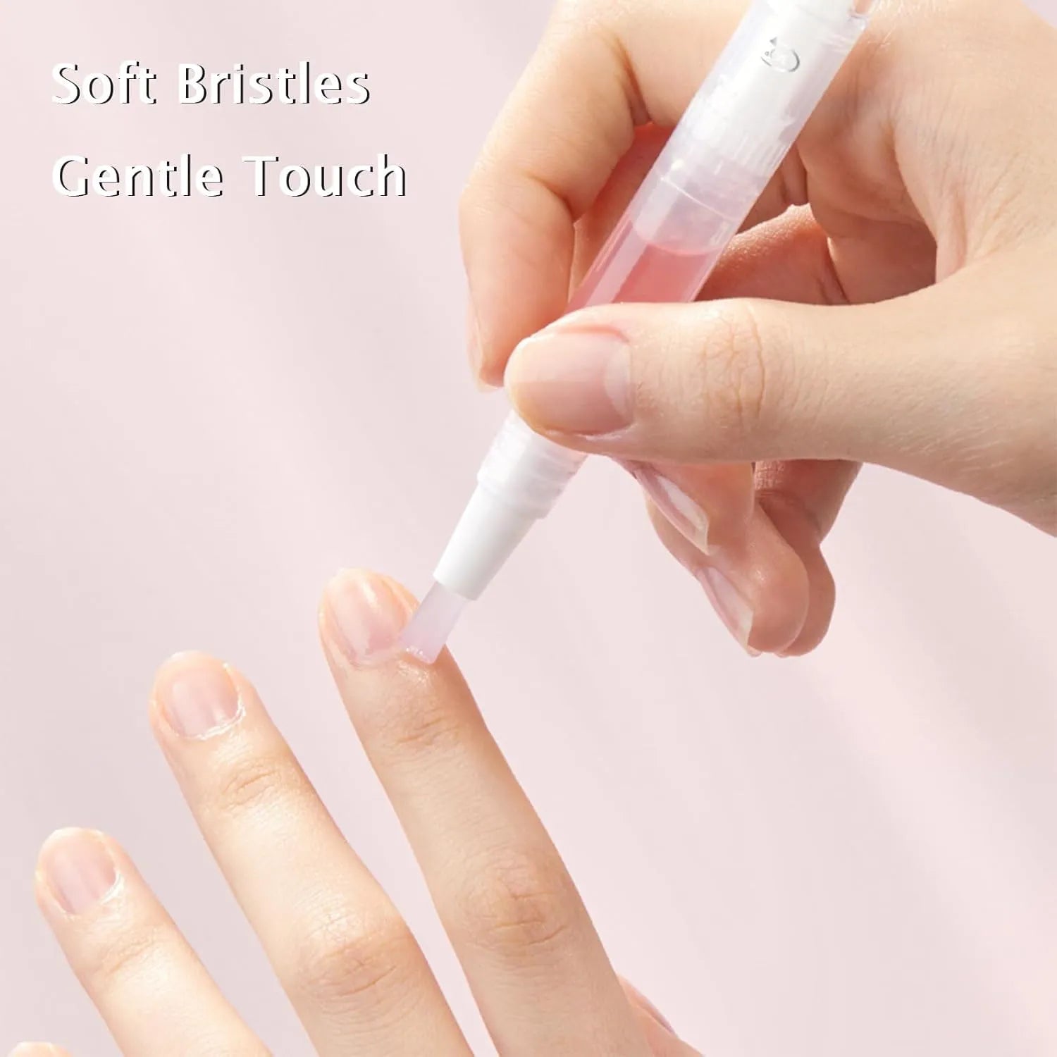Hand holding a small brush with text 'Soft Bristles Gentle Touch' on a light pink background