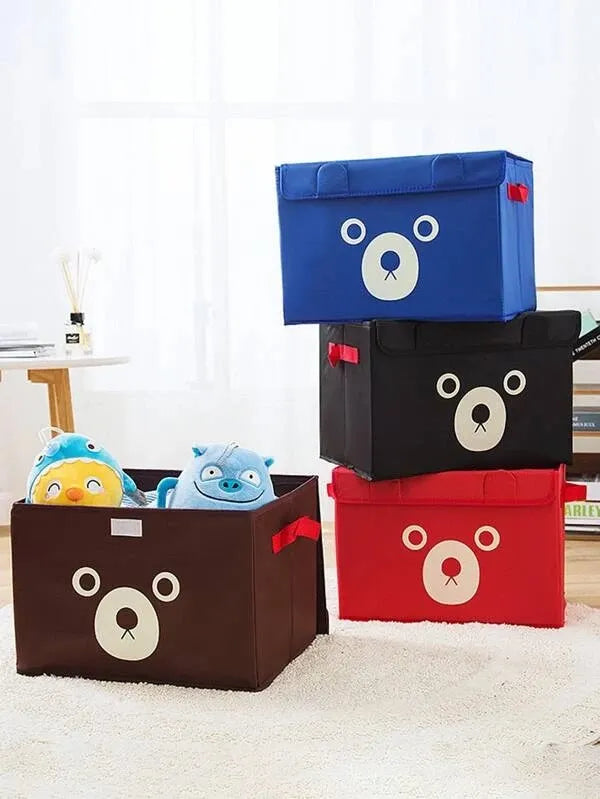 Stack of colorful storage boxes with bear faces on a light background
