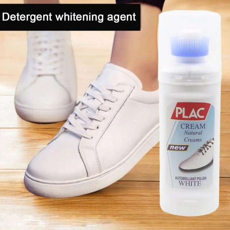 A bottle of PLAC Cream Natural Creams white polish next to a person wearing a white leather sneaker on a wooden floor, with a text overlay 'Detergent whitening agent'.