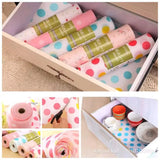 Polka dot cabinet shelf liner for protecting surfaces from scratches, dust, and spills.