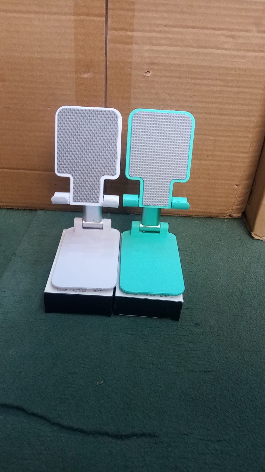 Portable adjustable phone stand for watching videos, reading, and attending online meetings.