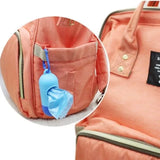 Peach-colored backpack with a blue keychain attached to a pocket
