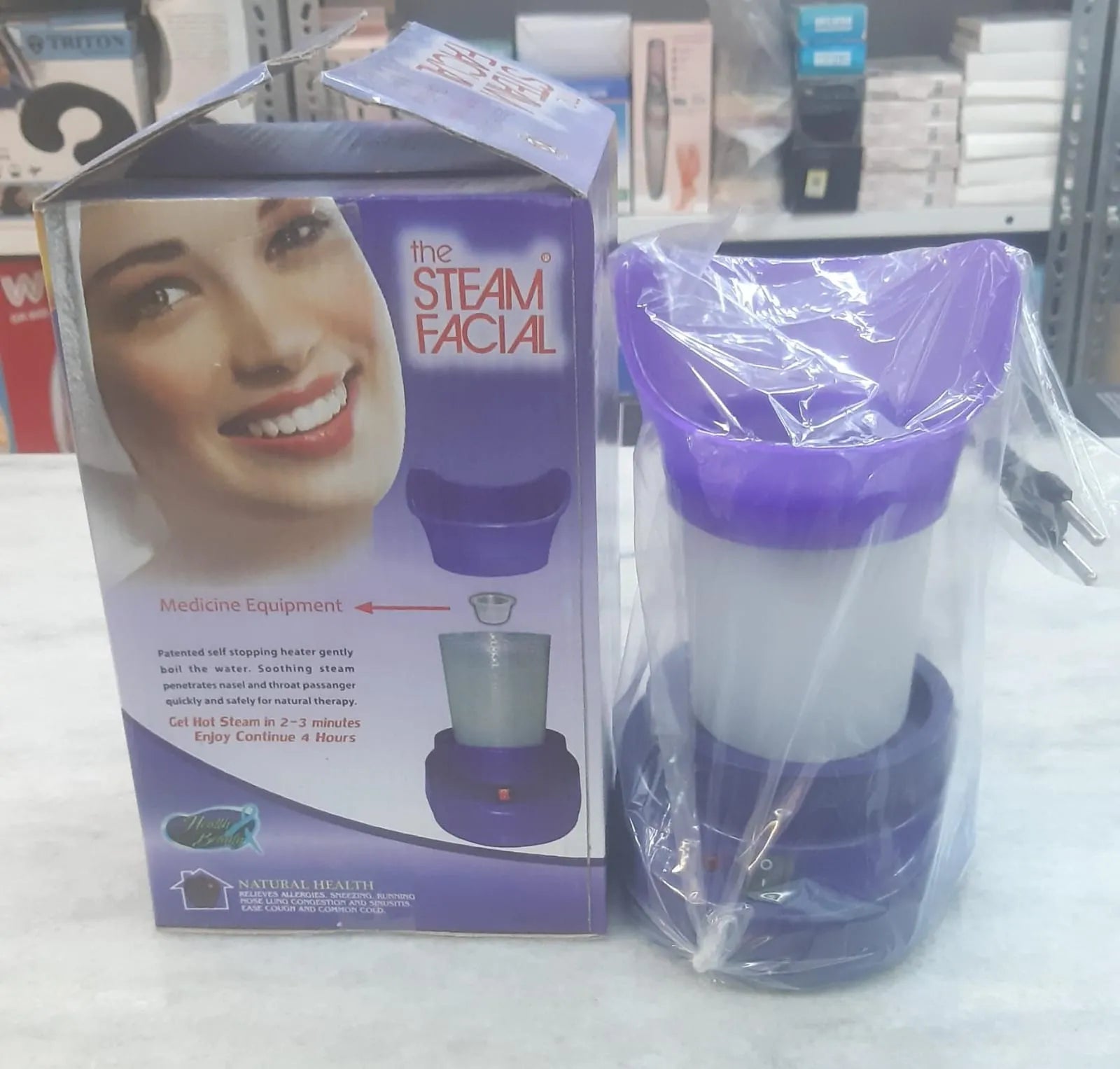 Steam facial device with packaging on a store shelf