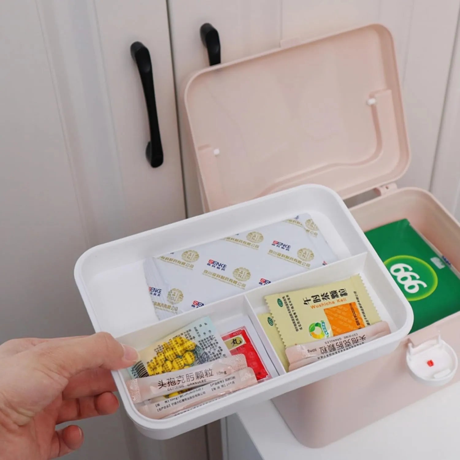 Portable first aid medicine box designed for safe storage of medicines and first aid essentials.
