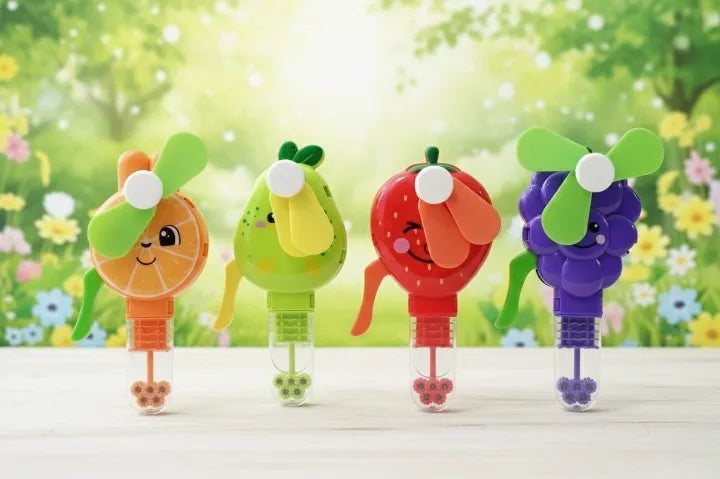 Four colorful cartoon-style fans with fruit designs on a wooden surface and floral background