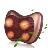 Copper-colored massage pillow with green leaves on a white background