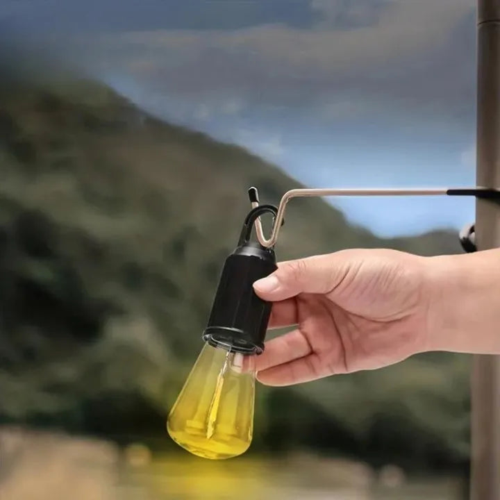 Portable LED camping lantern with a built-in hook and rechargeable battery for convenient illumination.
