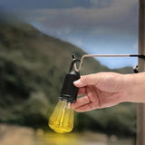 Portable LED camping lantern with a built-in hook and rechargeable battery for convenient illumination.