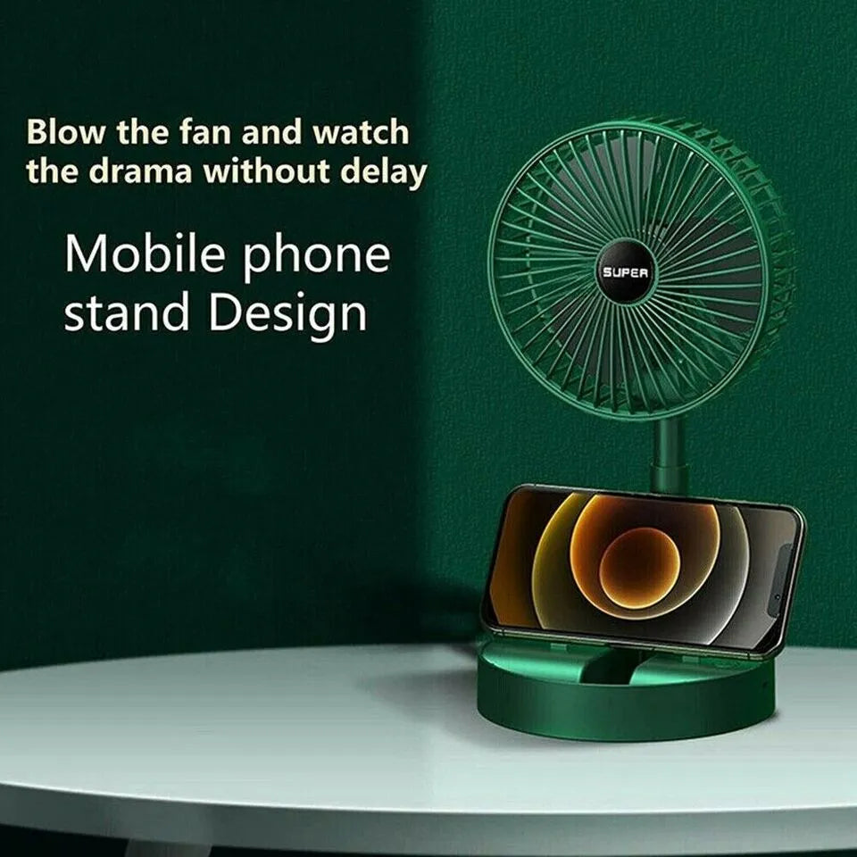 Green fan with phone stand on a white surface against a dark green background