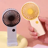Portable USB rechargeable handheld fan for quiet and efficient personal airflow on the go.