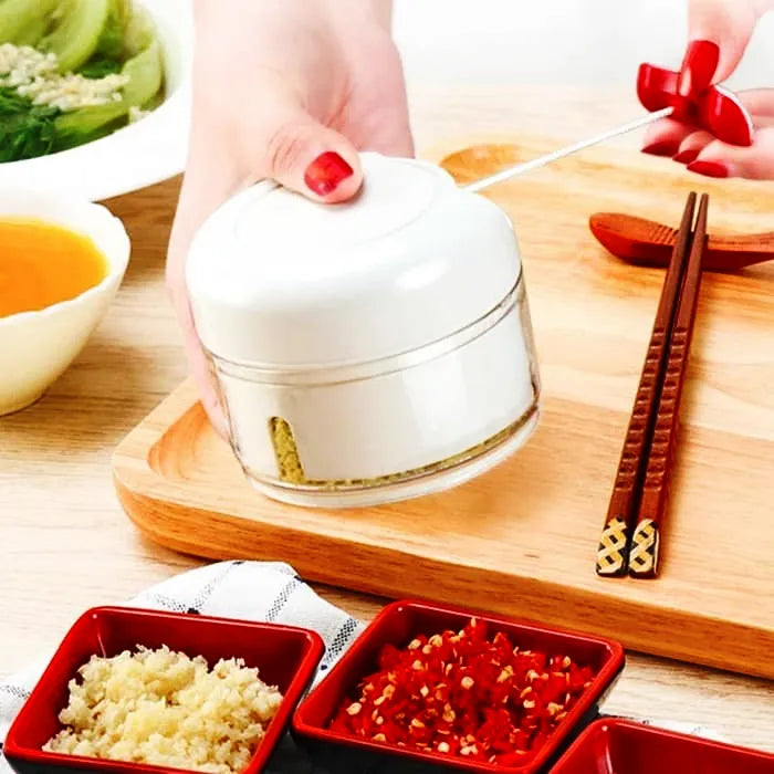Power food chopper for convenient chopping and mincing of vegetables, fruits, and herbs.
