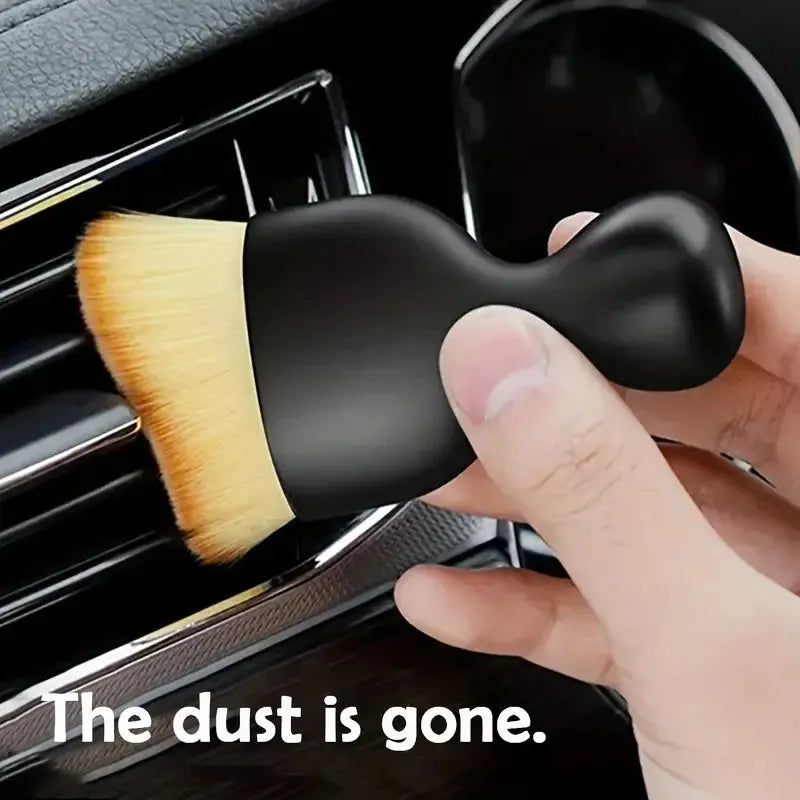 Premium soft-bristle car interior cleaning brush for removing dust from dashboards, vents, and trims.