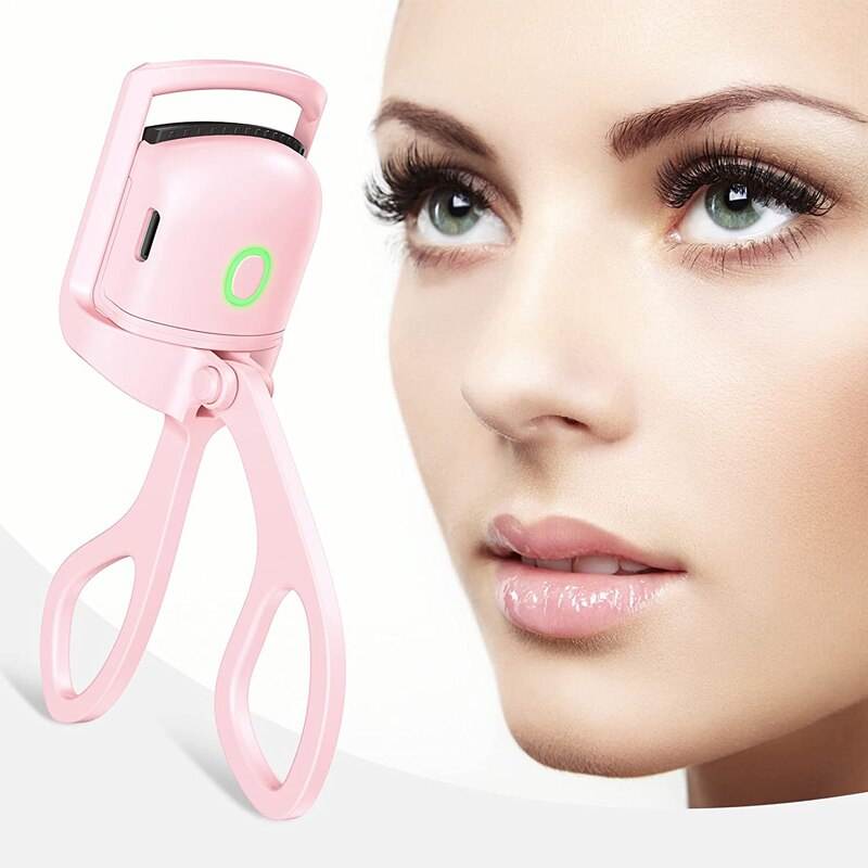 Pink eyelash curler next to a close-up of a woman's face with long eyelashes.