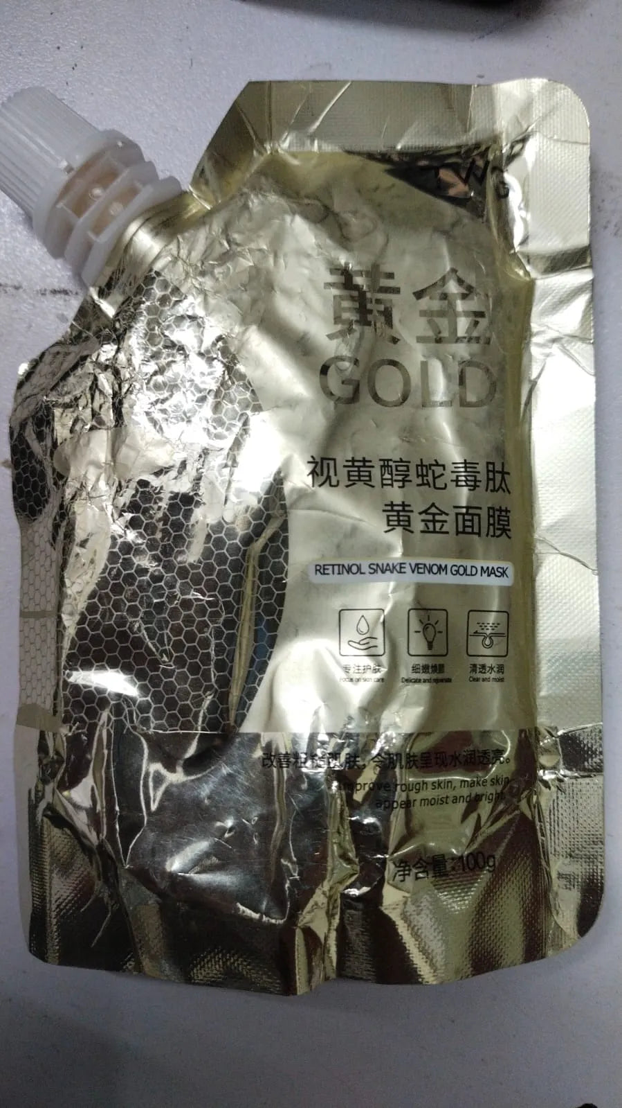 Luxury retinol face mask with gold elements for a refreshing and hydrating beauty routine.