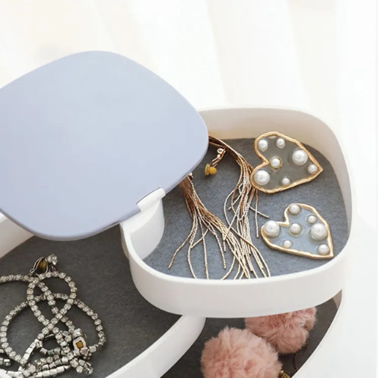 Rotating jewellery storage organizer designed to keep accessories organized and easily accessible.