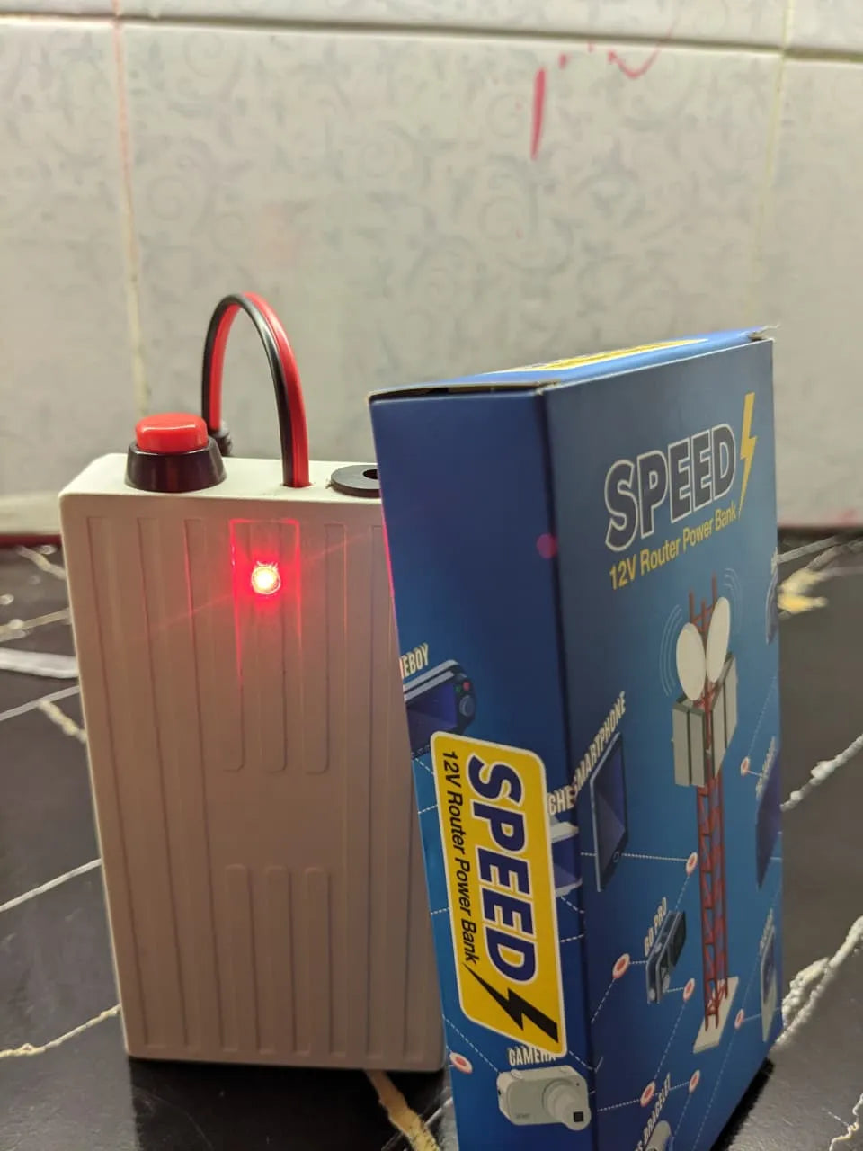 Portable mini UPS for WiFi routers with a 20,000mAh battery capacity for continuous backup power.