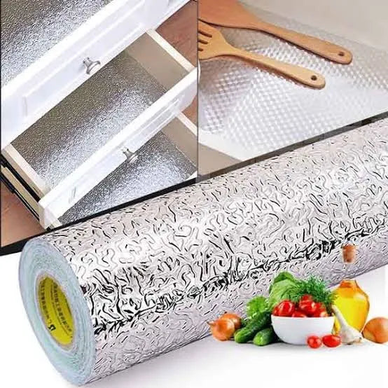 Self-adhesive aluminum foil sticker for durable protection of cabinets, shelves, and countertops.